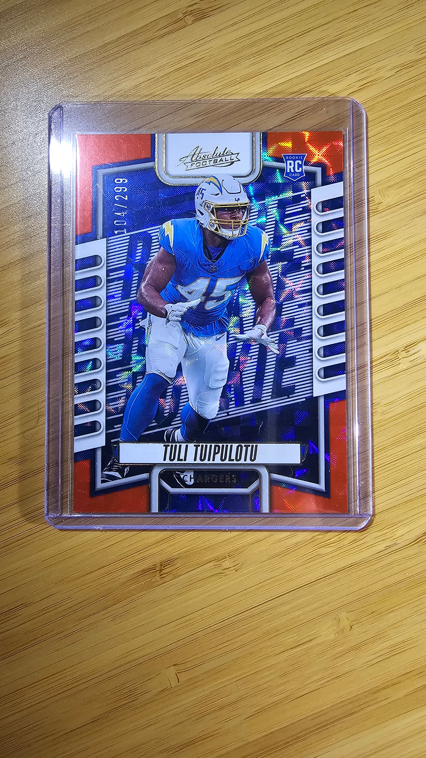 2023 Panini Absolute football Tuli Tuipulotu - RC Orange Mosiac 104/299 - Los Angeles Chargers