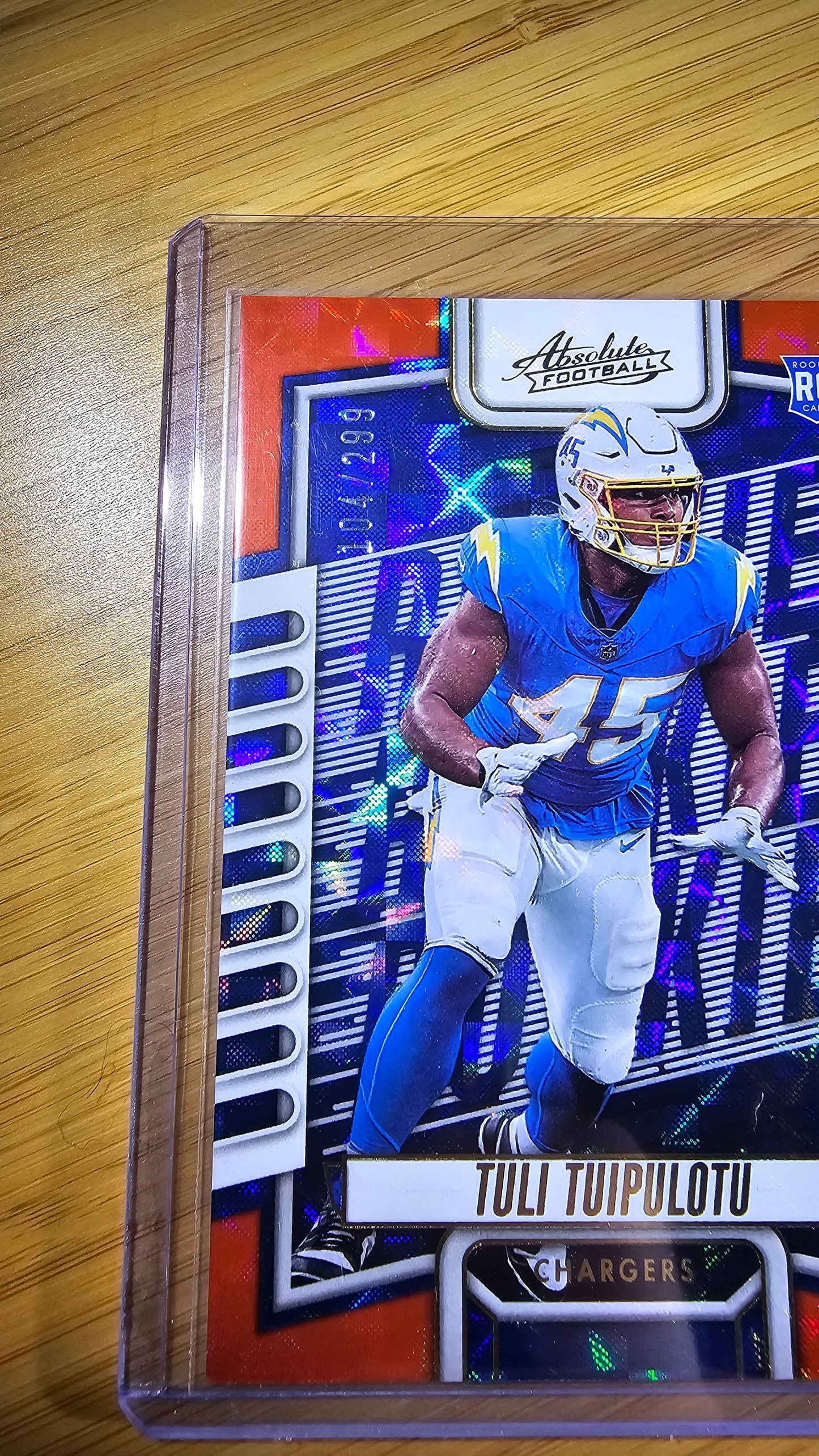 2023 Panini Absolute football Tuli Tuipulotu - RC Orange Mosiac 104/299 - Los Angeles Chargers